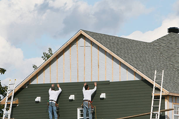 Professional Siding Installation technician working in Winchester, IL